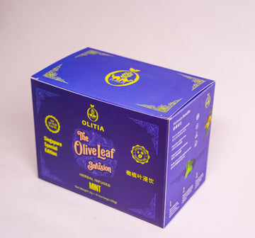 A blue and purple cardboard box of Olitia The Olive Leaf Infusion herbal tea, photographed on a light neutral background.